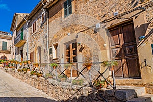 Street with flowers of Valldemossa the old mediterranean village in the mountain, landmark of Majorca island, Spain