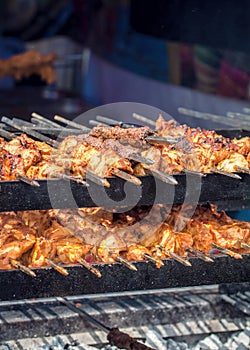 Street Food. Chicken On Skewers Cooking Over Charcoal Grill