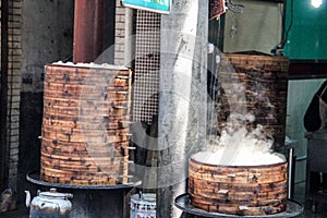 Street food in china. Dumplings cooking inside traditional bamboo steamers, Xian