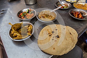 Street food in Egypt - Falafel with fires, salad, fuul made of beans, bre