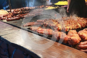 Street food: grilled sausages, shish kebab and pork knuckle