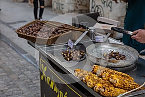 Street food. Grilled sweet corn and chestnuts, Ermou street Athens, Greece