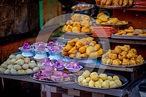 Street food mirchi vada and other pastries in Nathdwara, India.