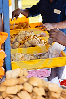 Street food vendor selling fried snacks in Asia photo