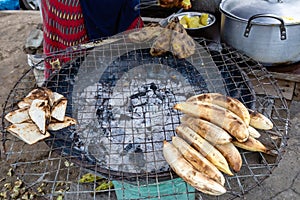 Street foods in Lagos Nigeria; Bole otherwise known as roasted plantain, along with yam and sweet potato photo