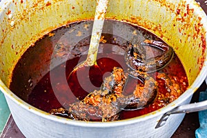 Street foods in Lagos Nigeria; Eja kika in stew; Ewa Agoyin Sauce