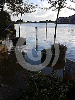 Street furniture in the water due to high water on river Holland