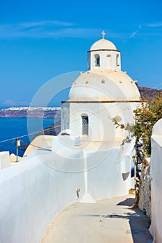 Street with greek orthodox church in Santorini