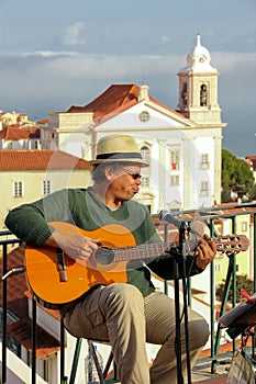 Street guitar player in Alfama quarter. Lisbon . Portugal