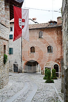 Street and historical buildings in Cividale, Italy