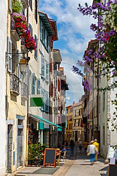 Street with historical houses in Bayonne city center.