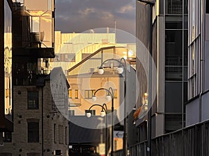 street  industrial  building modern  and vintage architecture windows street lantern light at sunset  urban city life Tallin