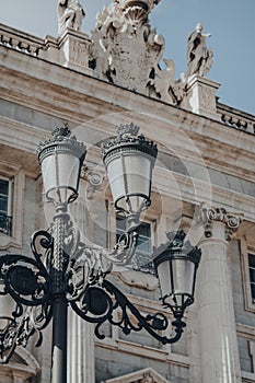 Street lamp against the exterior of Amudena Cathedral Catedral de la Almudena, Madrid, Spain photo