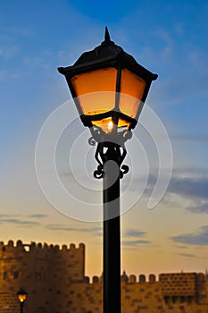 Street lamp on blue dusk sky background