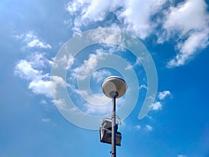 Street lamp with blue sky background.