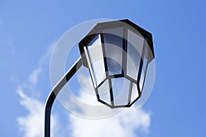 Street lamp by cemetery with summer sky on Haga photo