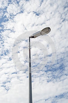 Street lamp with clouds sky