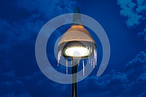 Street lamp covered in snow and icicle photo