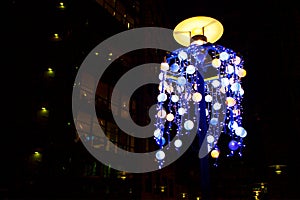 Street lamp with garlands