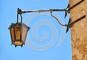 A street lamp on the house wall in Mdina. Malta