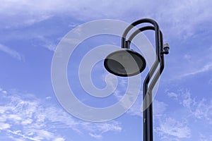 Street lamp or light pole with blue sky background