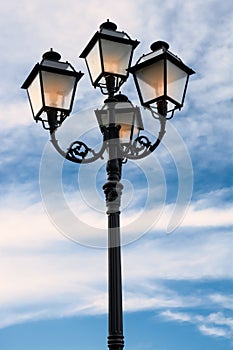 Street lamp lit at dusk