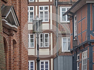 Street lamp and old European brick buildings in Stade, Germany.