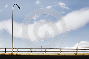 A street lamp overlooking a highway