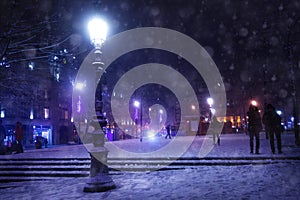 Street lamp on Republique square, Paris under snow