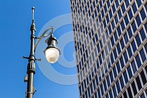 Street lamp and a skyscraper