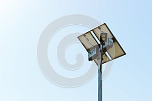 Street lamp with solar cell panel on blue sky background