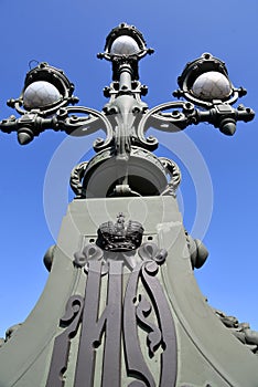 Street lamp on Troitsky bridge in Saint-Petersburg, Russia