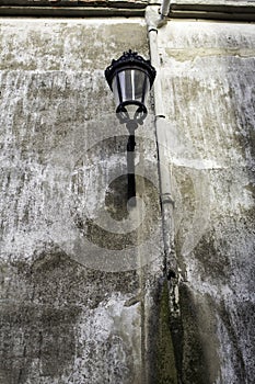 Street lamp in urban wall