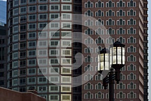 Street lamps against buildings