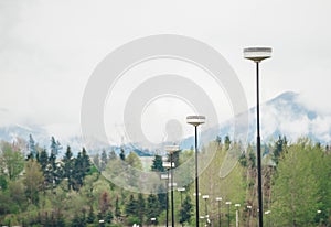 Street lamps placed on park alley. Poprad municipal park zone. Slovakia