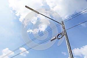 Street lamps and wires with line cables, transformers and phone lines