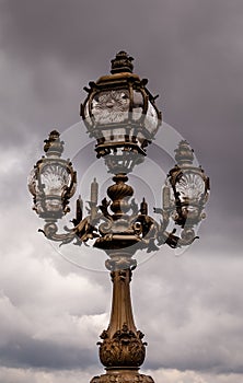 Street Lantern on the Alexandre III Bridge against Cloudy Sky