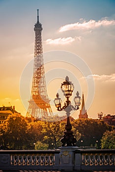 Street lantern on the Alexandre III Bridge against the Eiffel Tower in Paris