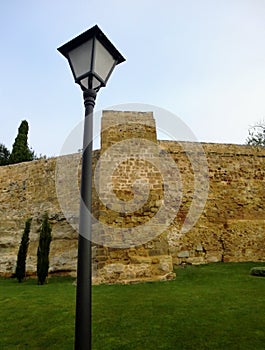 Street lantern and medieval fortress wall