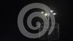 Street lanterns in dark. Night lights illuminate at the night. Image for design. Space for text