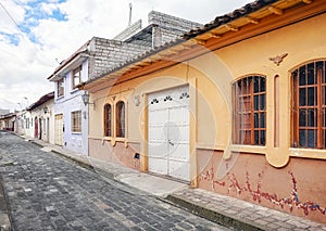 Street of Latacunga town paved with cobblestone, Ecuador photo