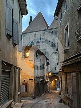 Street leading to the medieval gate in old town Carcassonne during the dawn, Occitania, France, February 2023