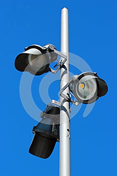 Street LED lamps against blue sky background