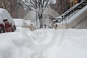 Street level shot during a blizzard with heavy snowfall in Harlem, New York City