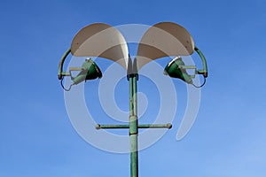 A street light against a blue sky