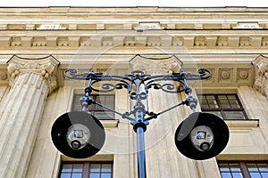 Street light closeup. antique style glass and wrough iron urban lamps