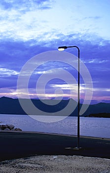 Street light in evening by the sea