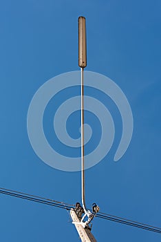 Street light with halogen lamp against blue sky in Thailand.