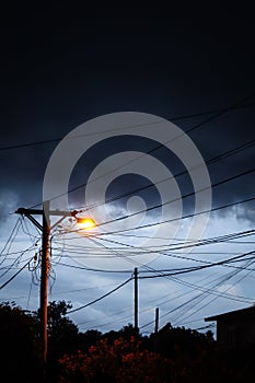 Street light at night with a stormy sky background