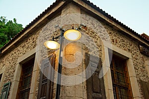 A street light and an old Ottoman time stone house on the streets of Antalya Old Town Kaleici